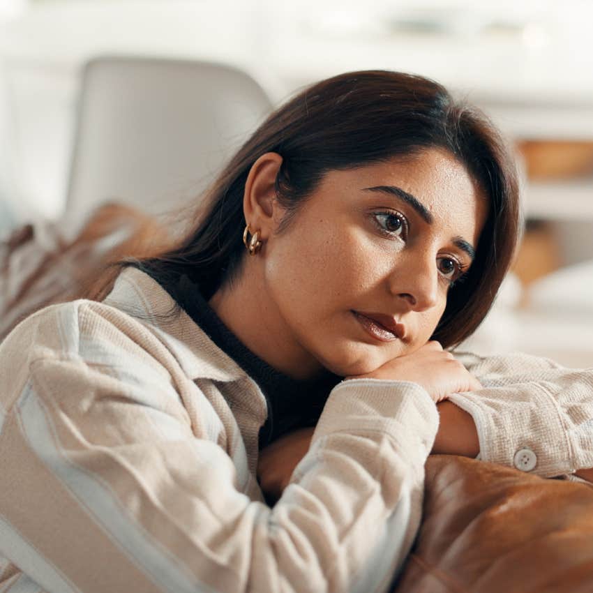 sad woman experiencing loneliness at home alone