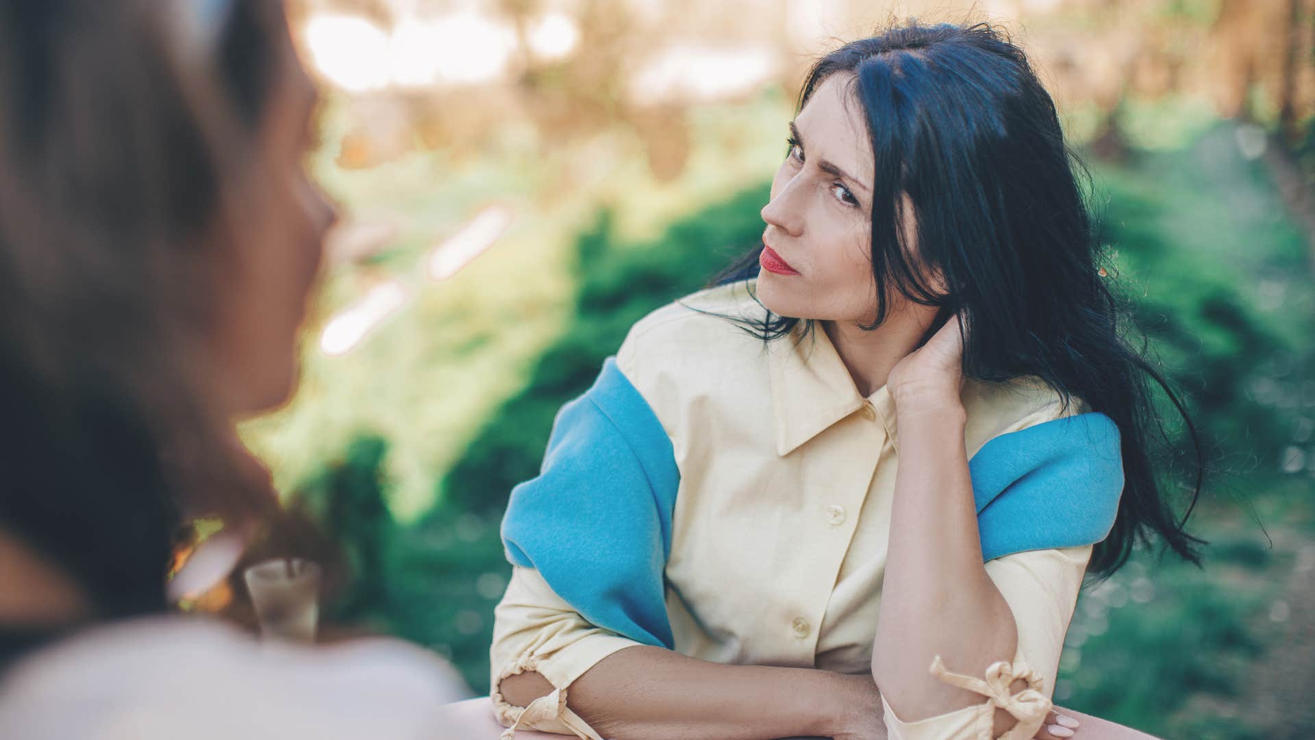 sad woman upset at fake friend for taking advantage of her kindness