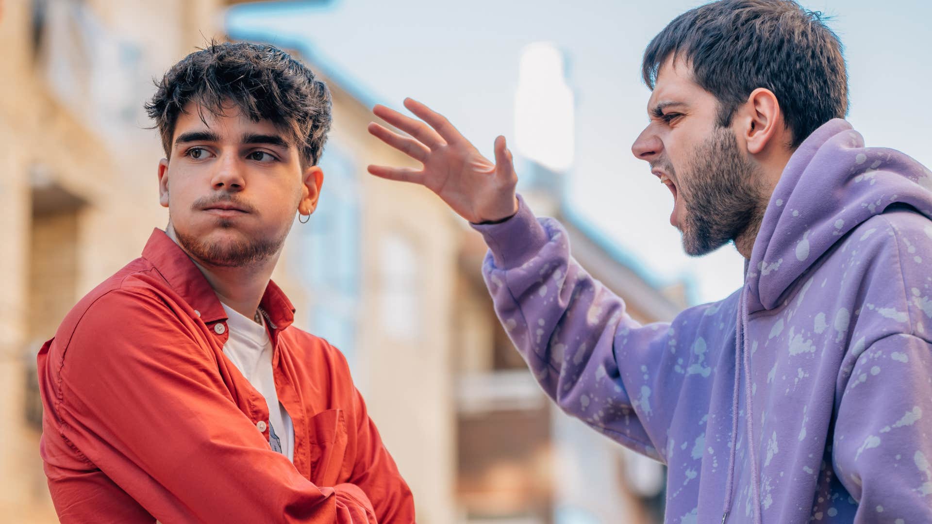 man being yelled at by fake friend who is competitive