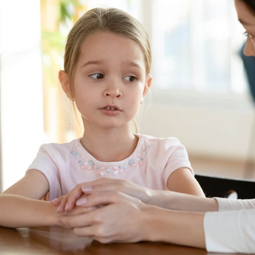 Little girl whose parents did a really good job her taking accountability sitting with her mother
