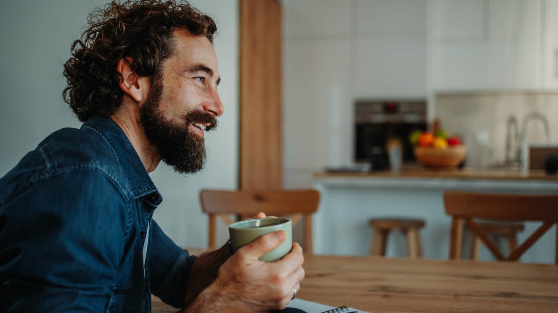 happy introverted man waking up early for alone time at home