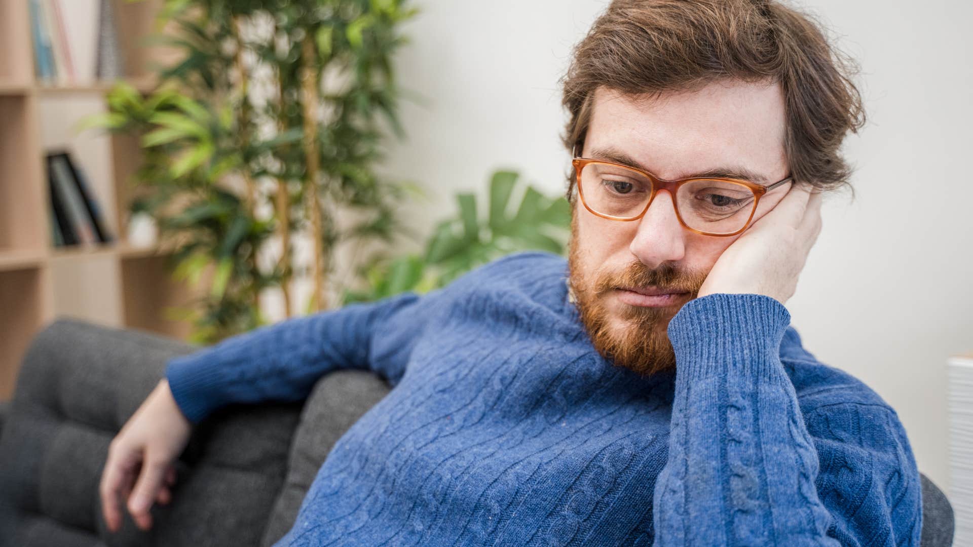 Man feeling unexpectedly lonely at home.