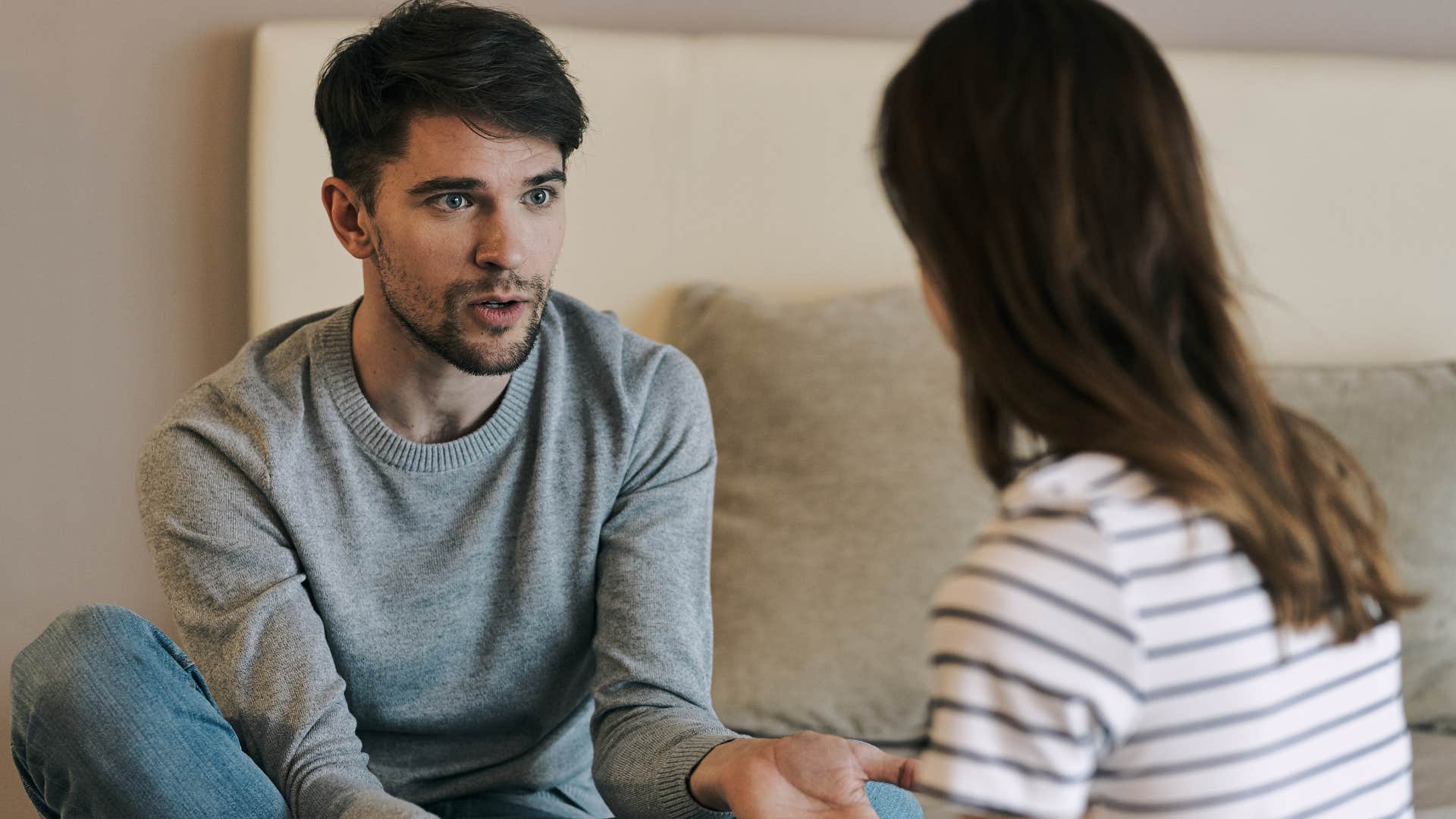 woman talking to man innocently rage baiting him by saying I love your pixie cut