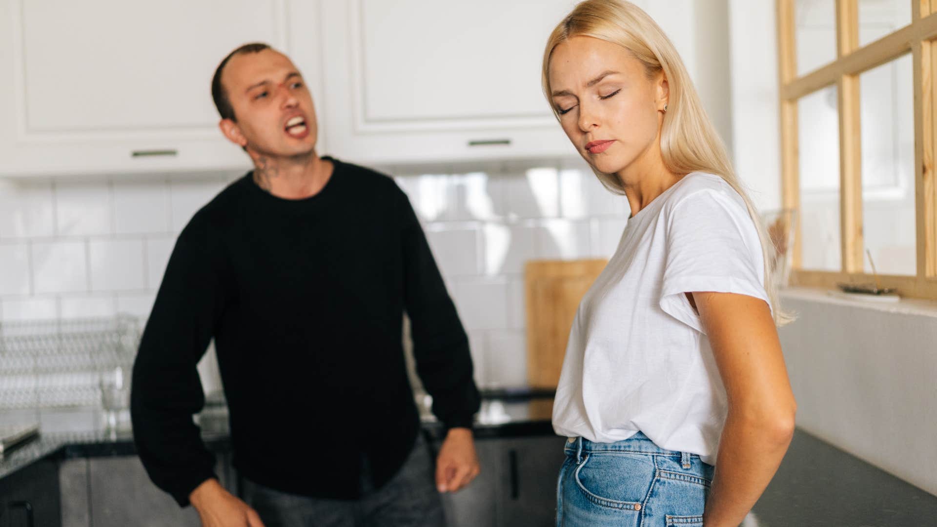 woman turned away from angry man after telling him you speak with the confidence of a much taller man