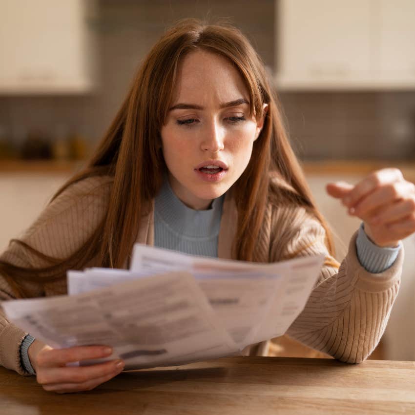 woman struggling to pay bills because inflation has outpaced earnings