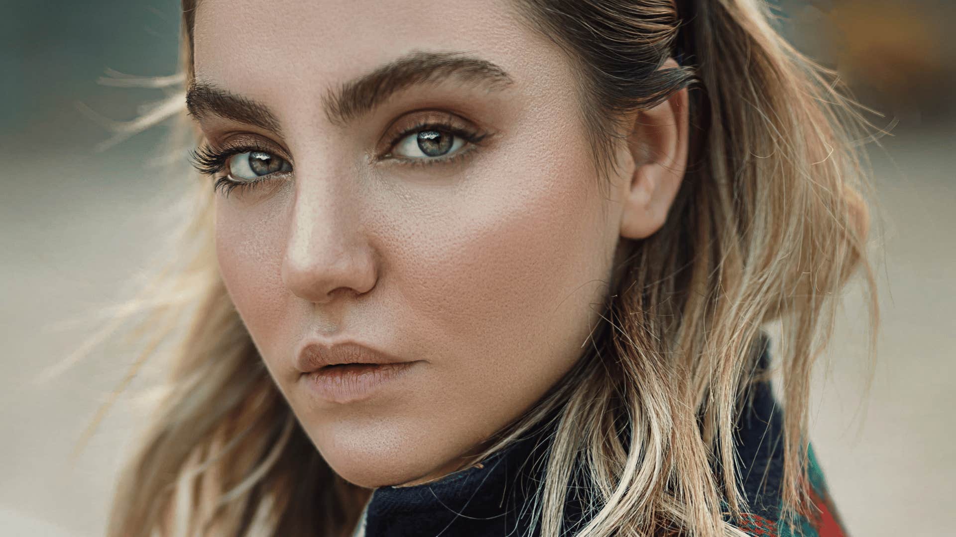 woman who grow up surrounded by conflict and suppresses her emotions