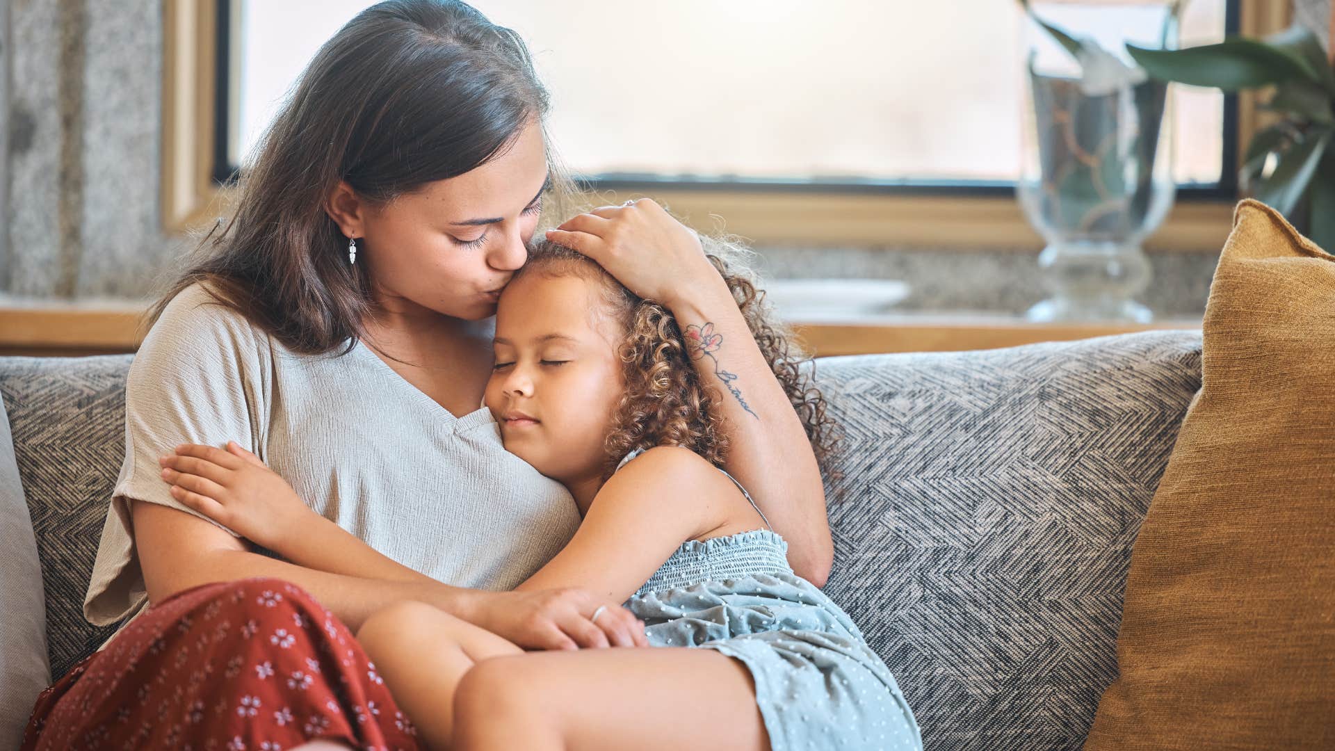 mom comforting upset daughter who needs reassurance