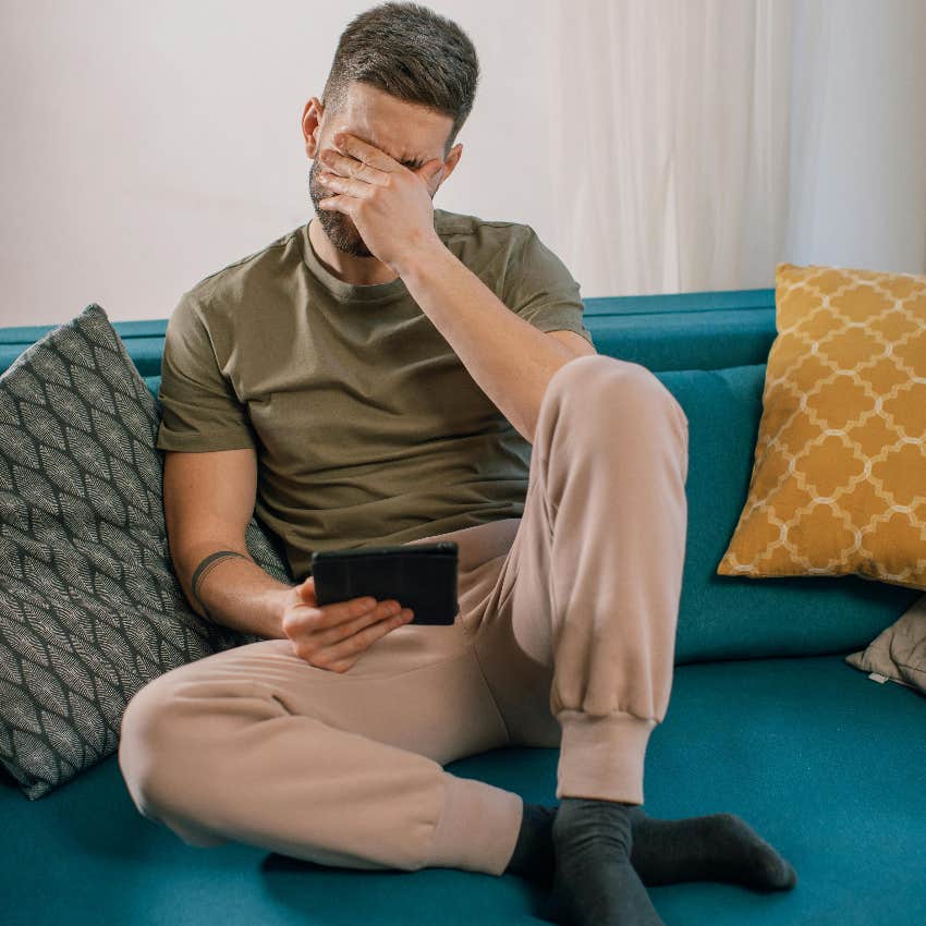upset tenant reading an email from his landlord