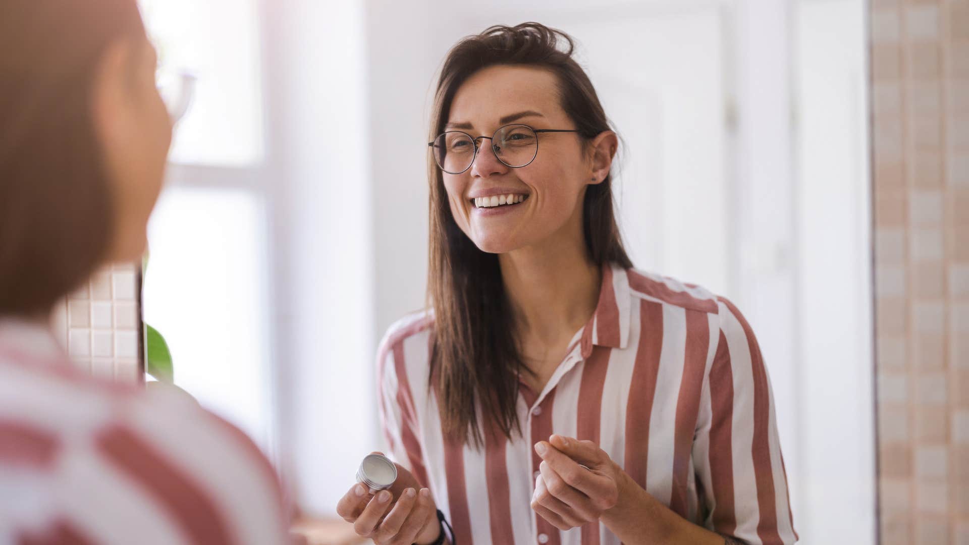 happy young woman feeling confident with herself