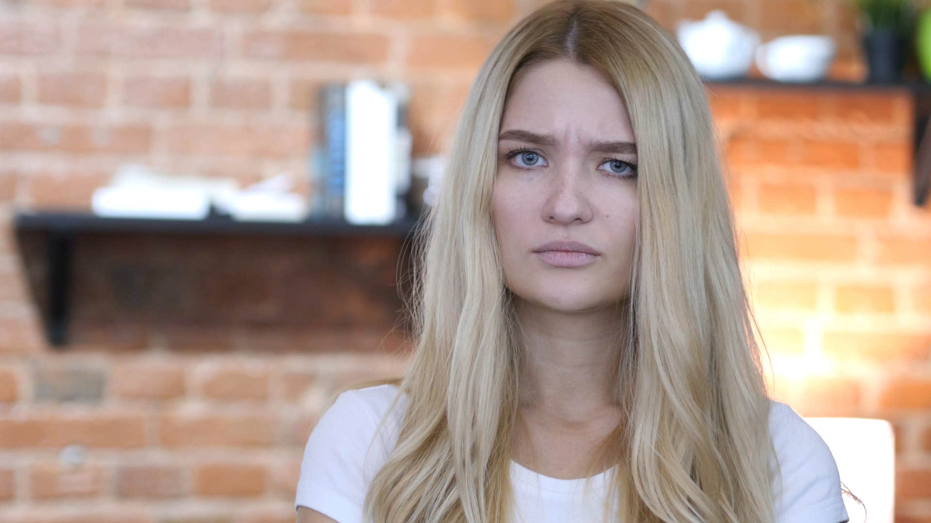 lonely woman looking sad tolerating man who gives no effort