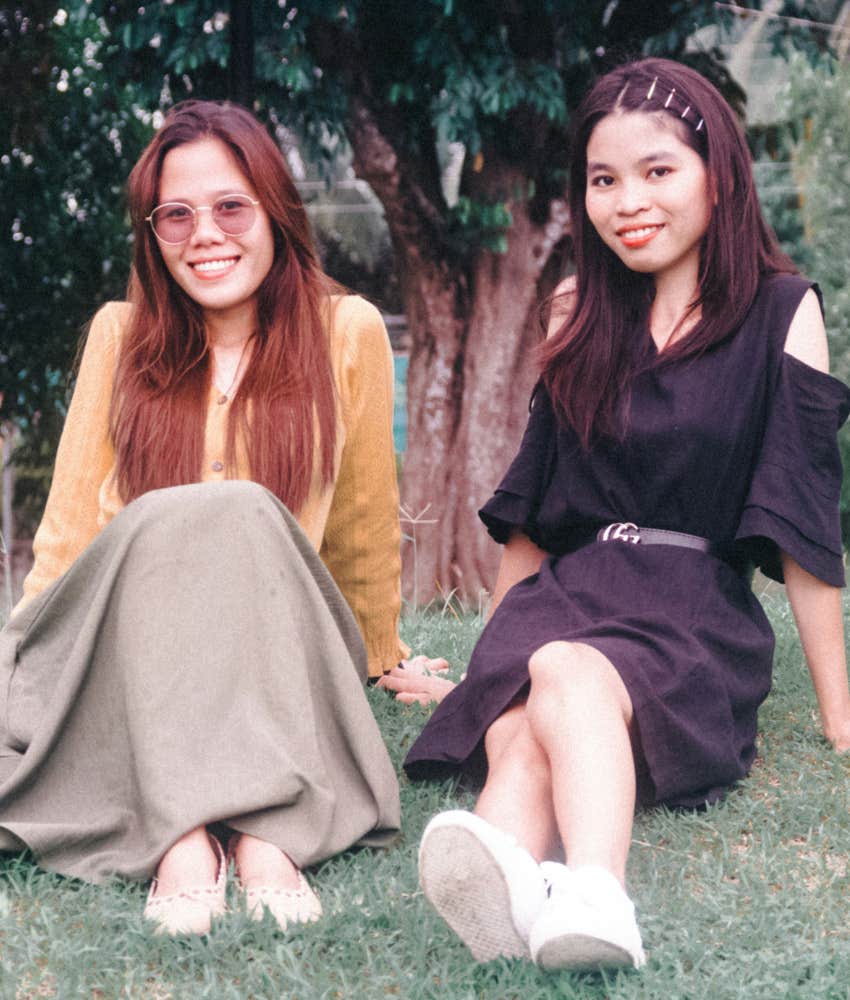 vintage image 1990s women sit on grass