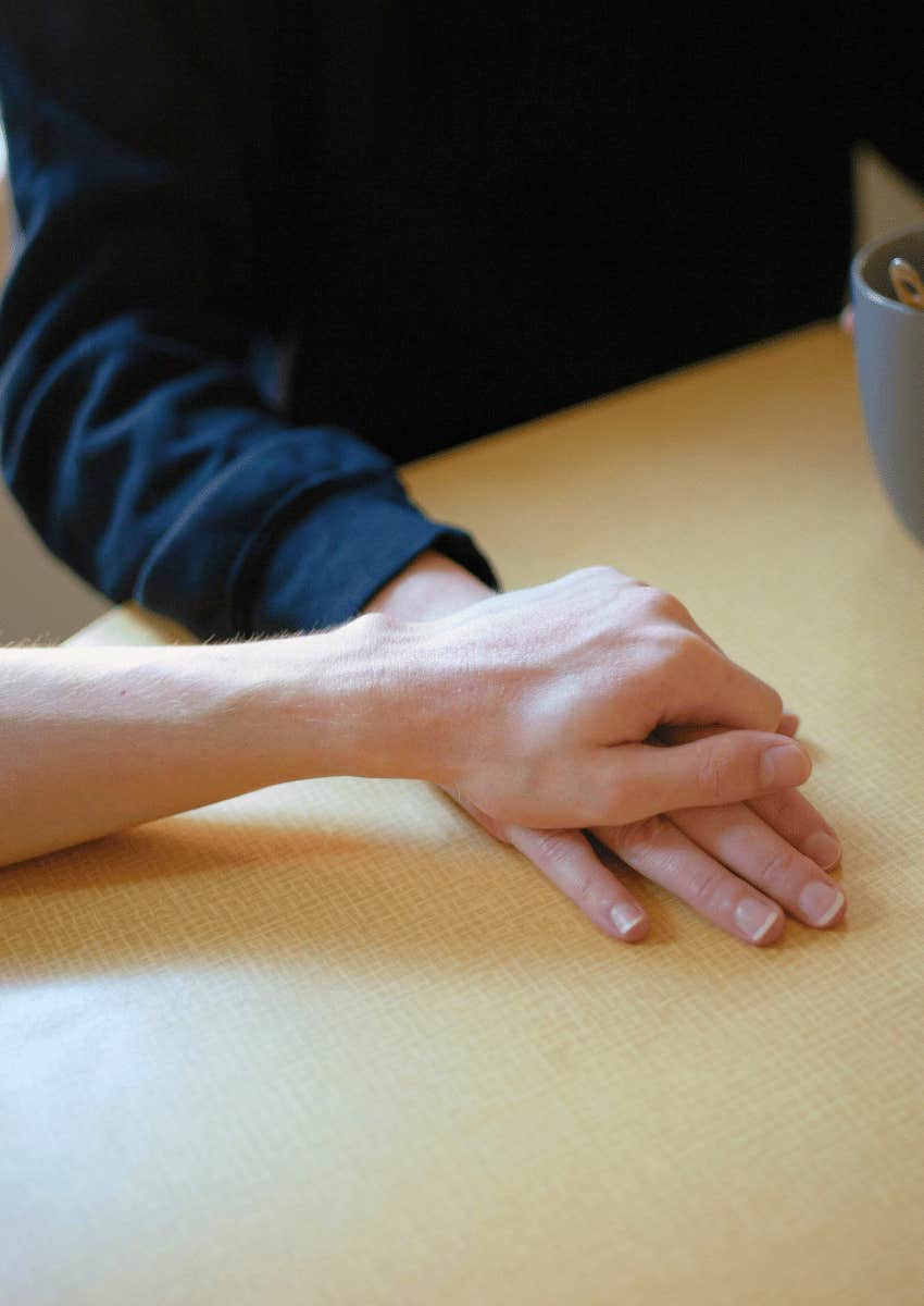 loved ones holding hands in comforting way