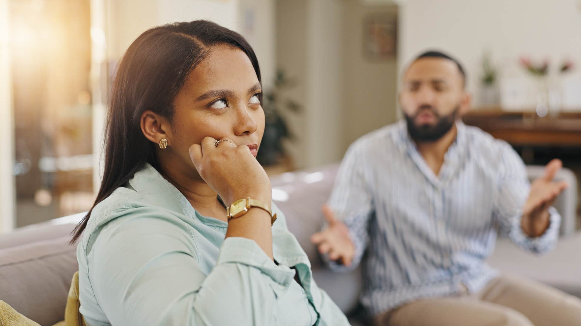 woman who is cheating not taking her husband's concerns seriously and ignoring him