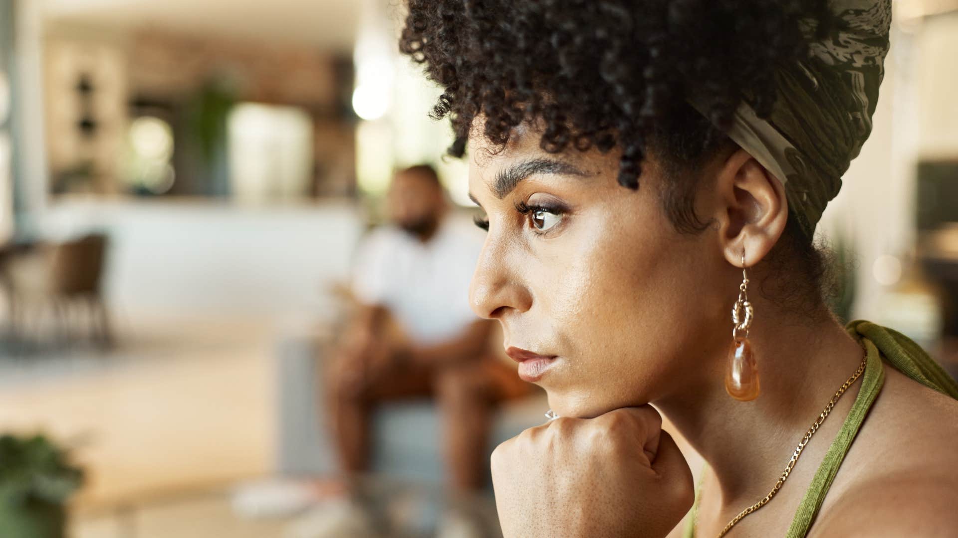 woman having a gut feeling something isnt right in her relationship