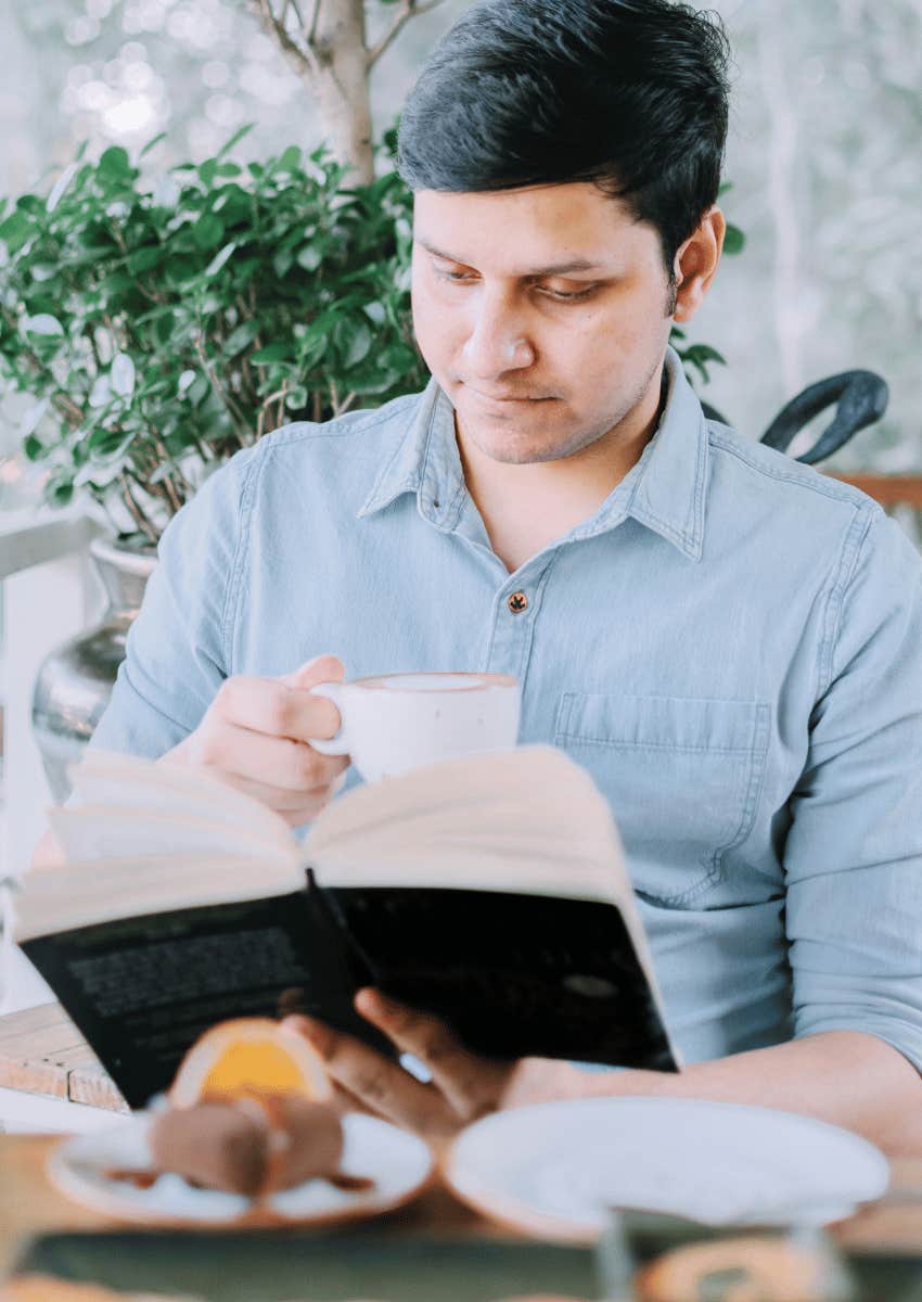 man reading not filling his space with constant distraction