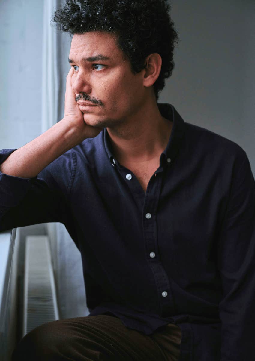 man sitting alone looking away