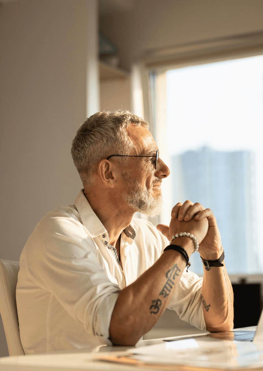 man sitting alone talking to himself to avoid a midlife crisis