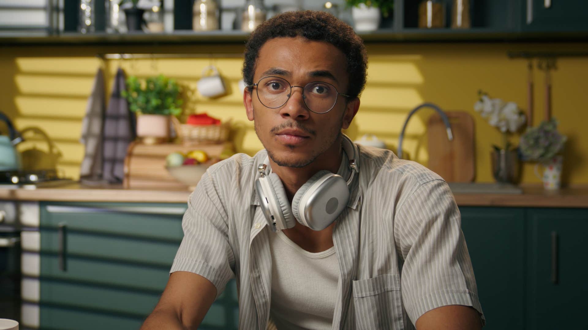 serious man with headphones saying i don't make mistakes