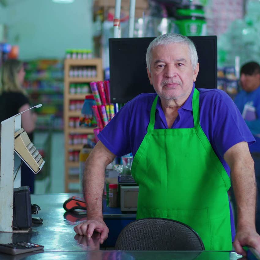 unhappy baby boomer cashier