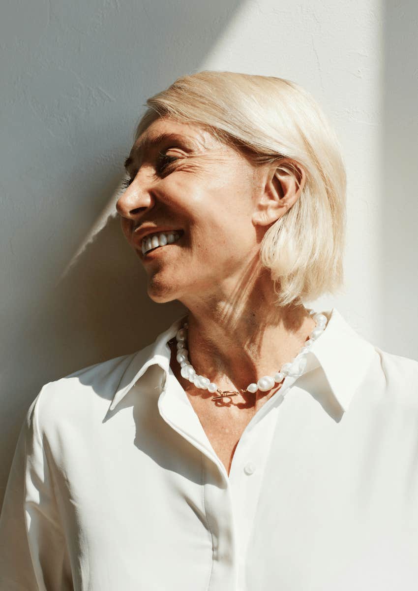 mature woman laughing exposing her wrinkles