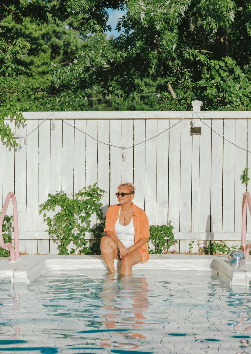 mature woman relaxing in pool alone