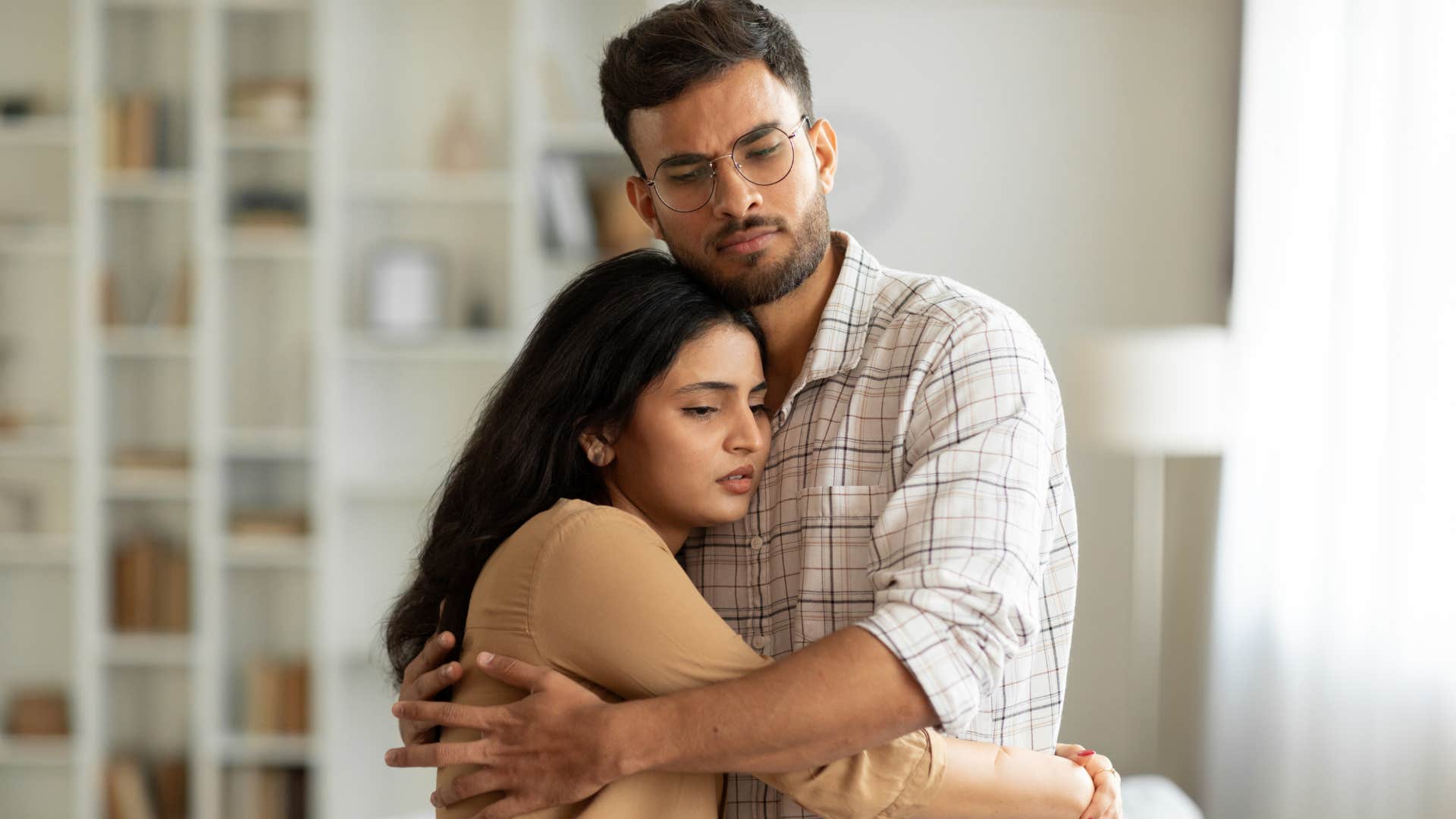 man who is easy to love comforting and hugging woman 