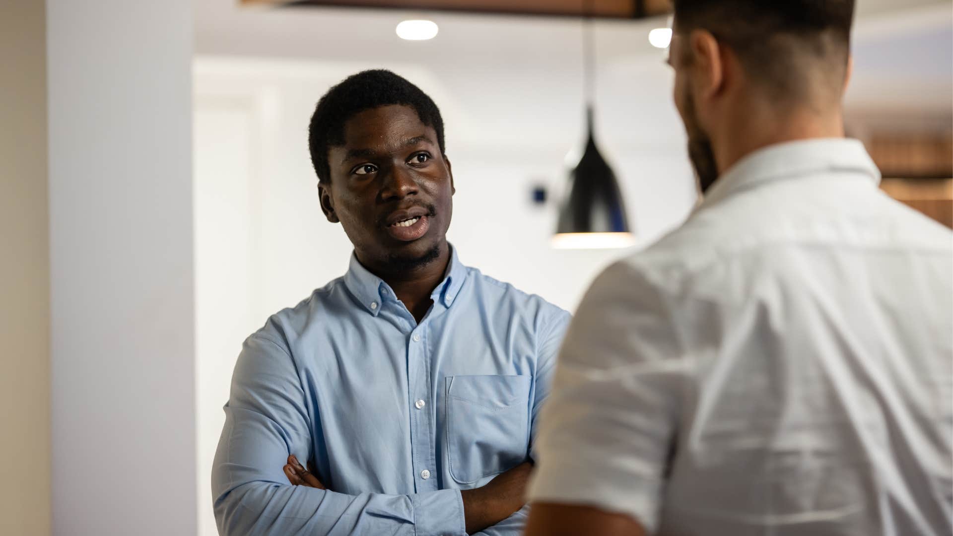 assertive man setting boundaries with colleague saying im not comfortable doing that
