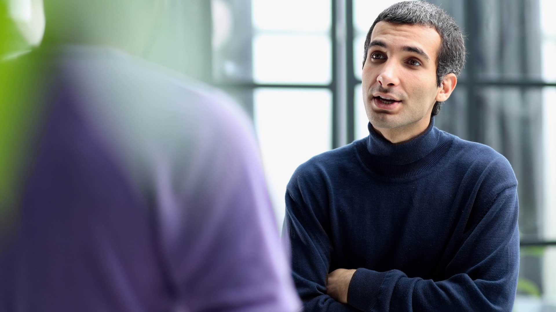 man who wants to be taken seriously talking in a deeper voice to a guy friend