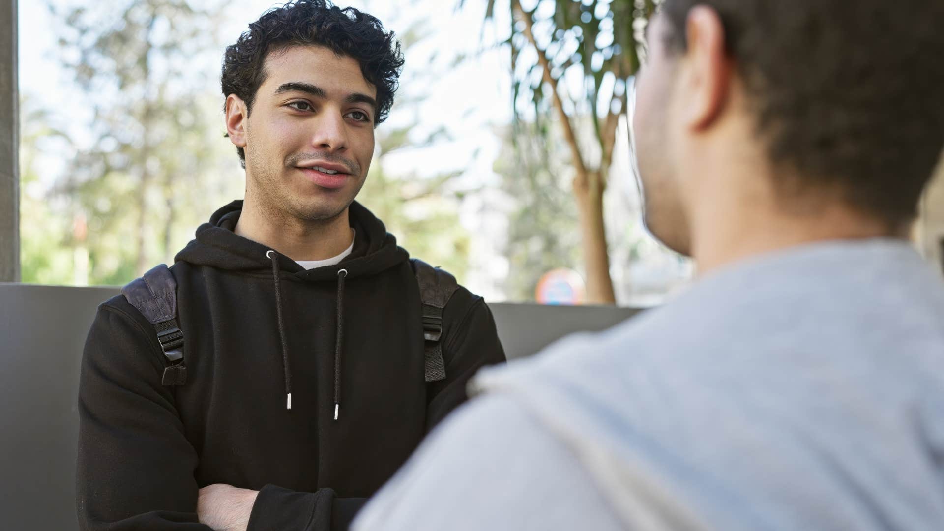 man who wants to feel strong talking to his friend