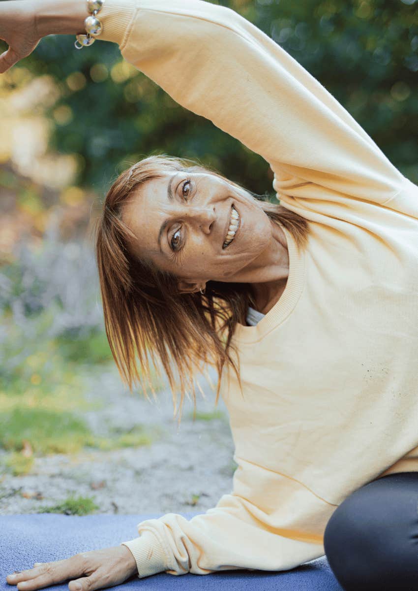 middle age woman taking care of herself by doing yoga
