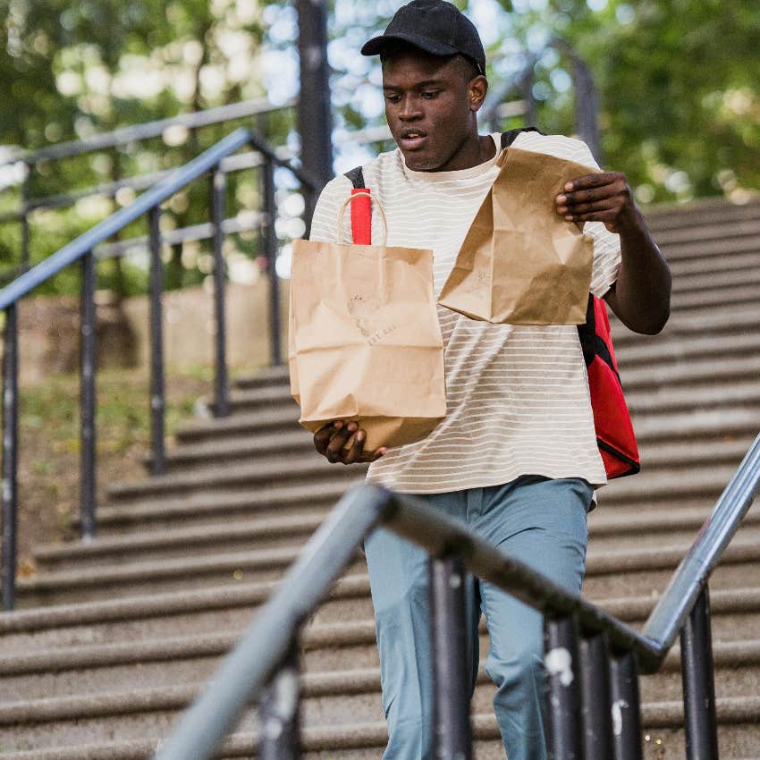 teen working by delivering food
