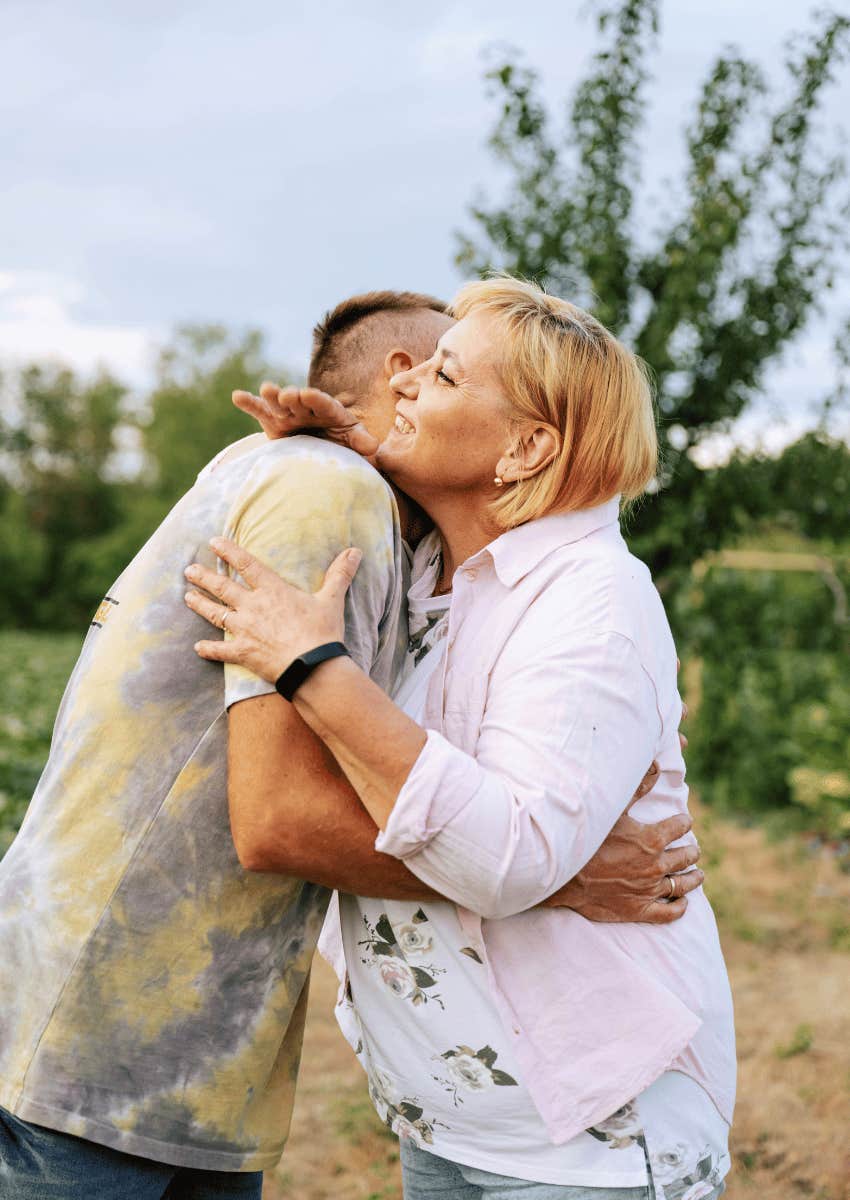 mom and adult son hugging