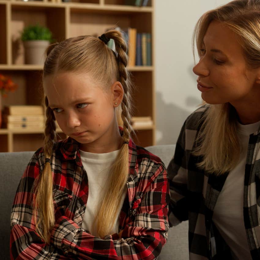 mom talking to upset daughter