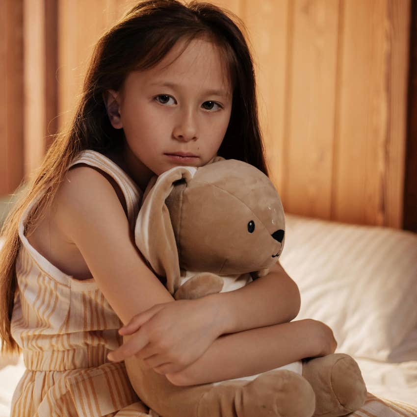 sad little girl left alone by her parents