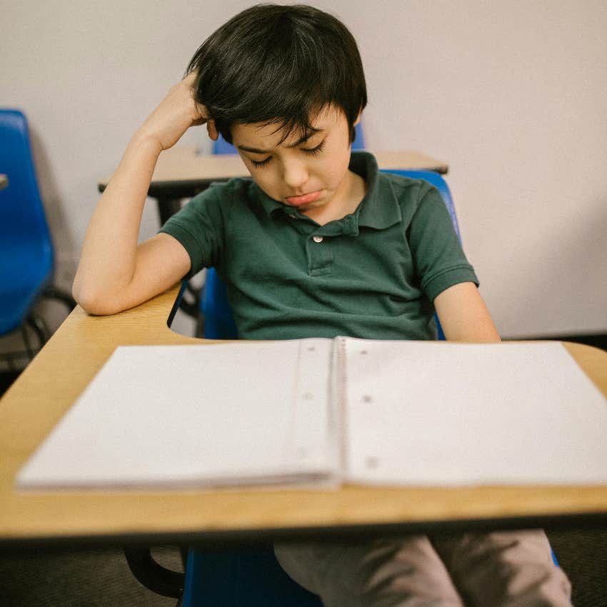 sad little boy being punished at school