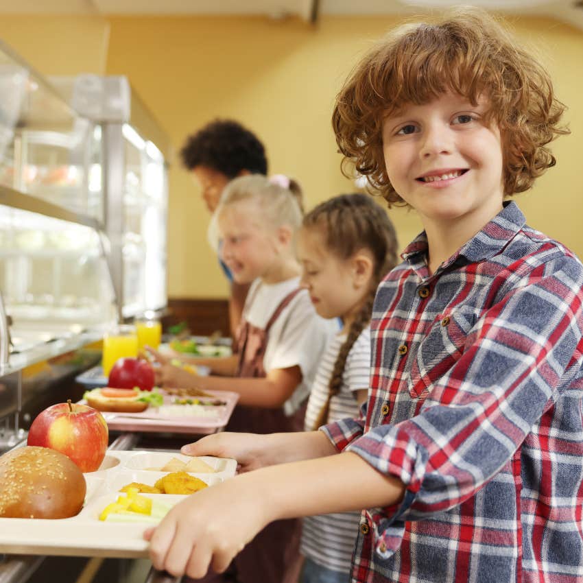 little boy eating school lunch mom continued to send food despite school's warning