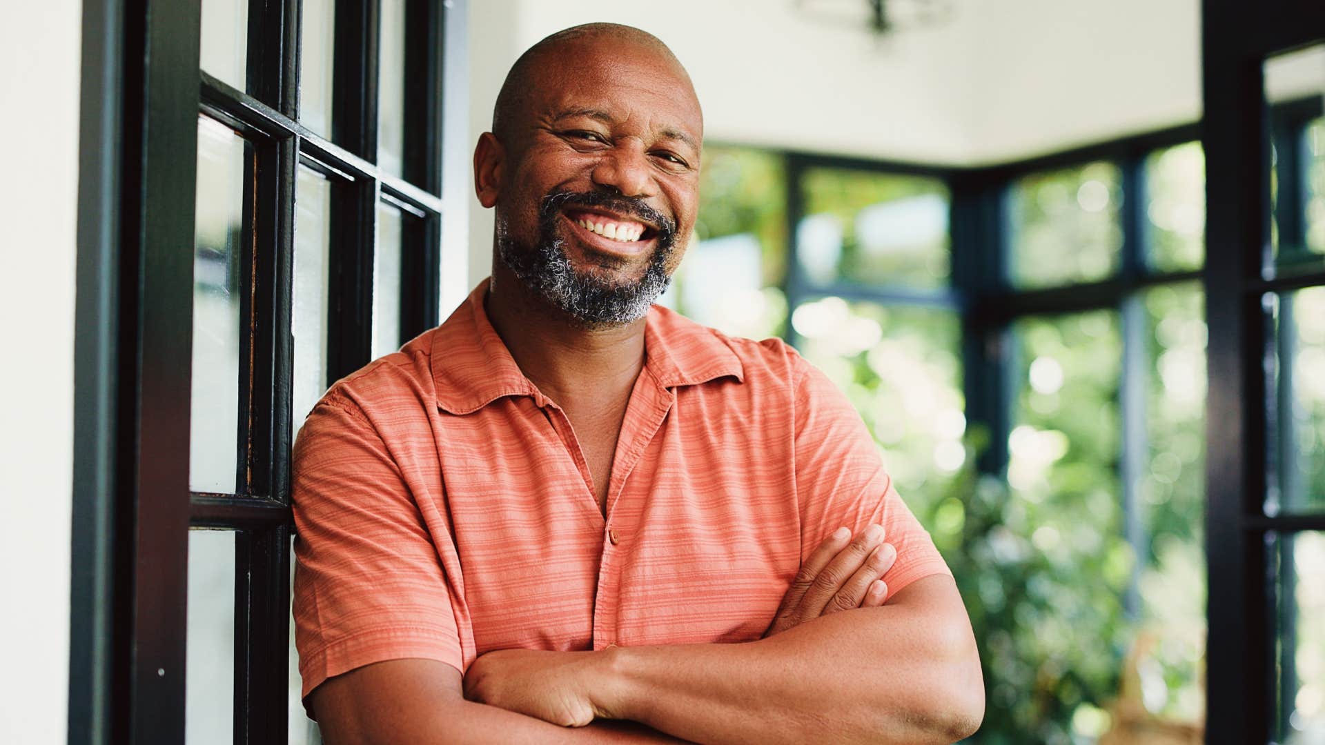 effortlessly funny man smiling confidently