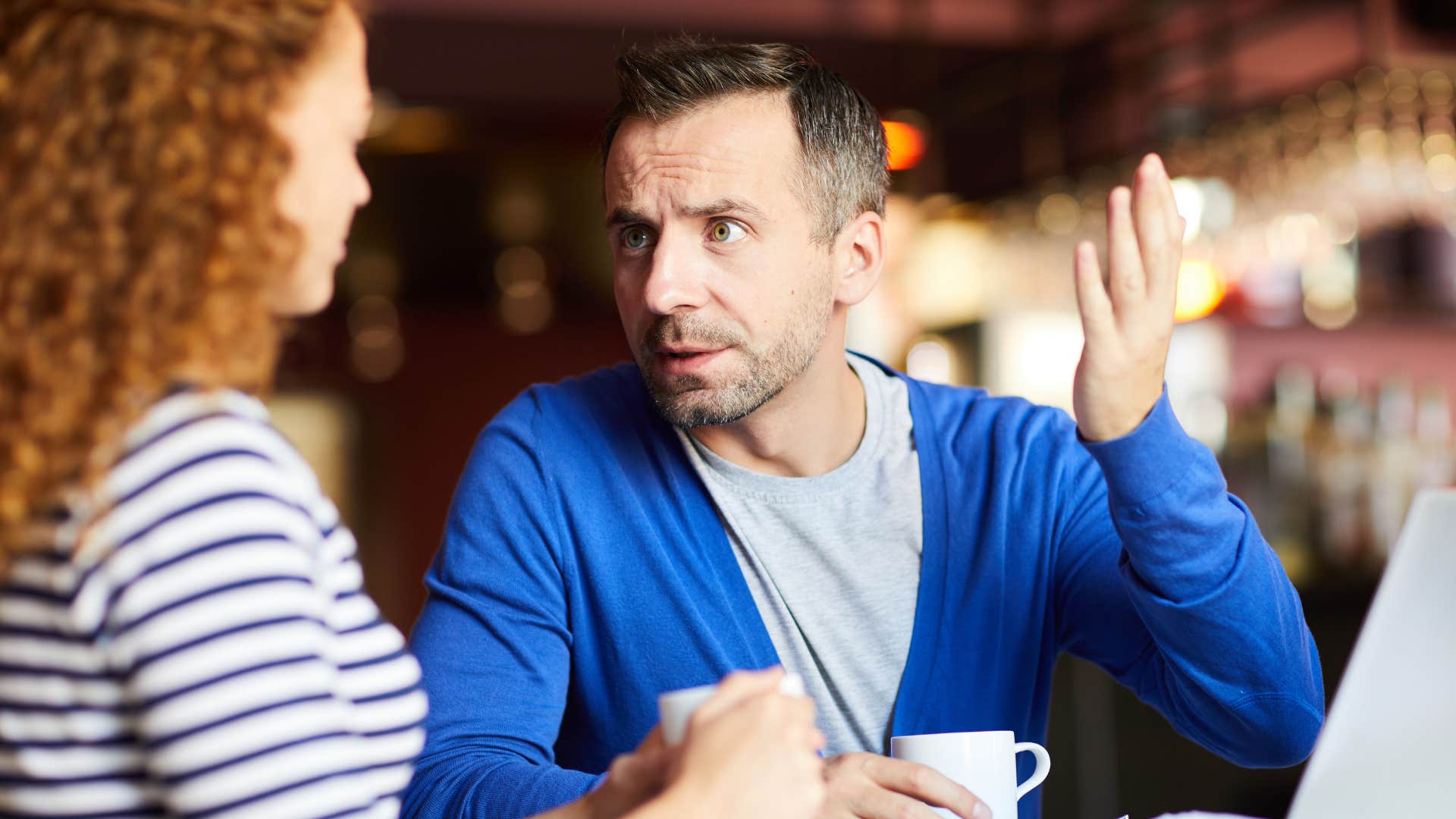 attractive man over 40 leaning into conflict without being defensive