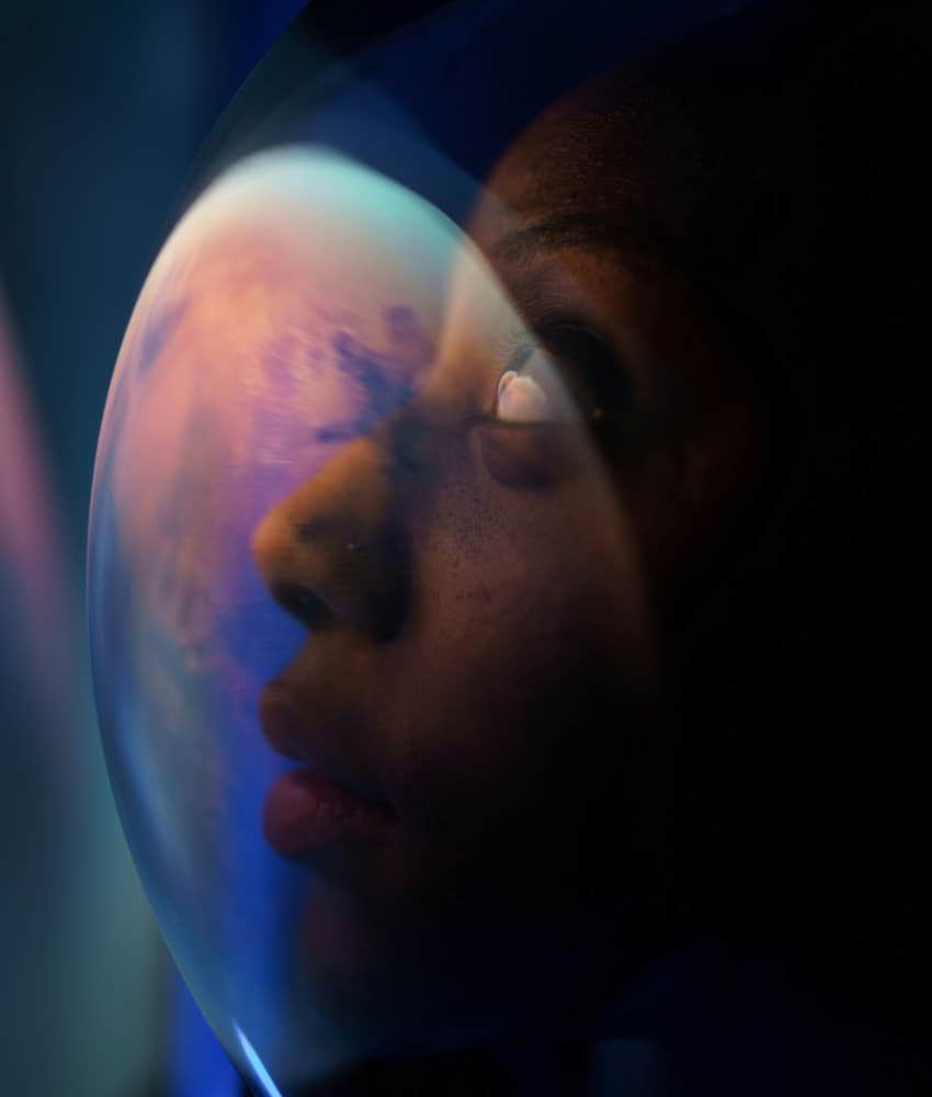 person in helmet looks at position in space