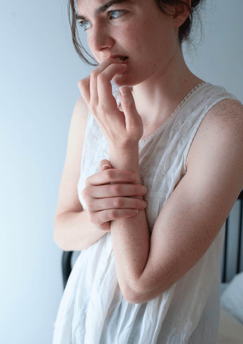 nervous expression on young adult woman