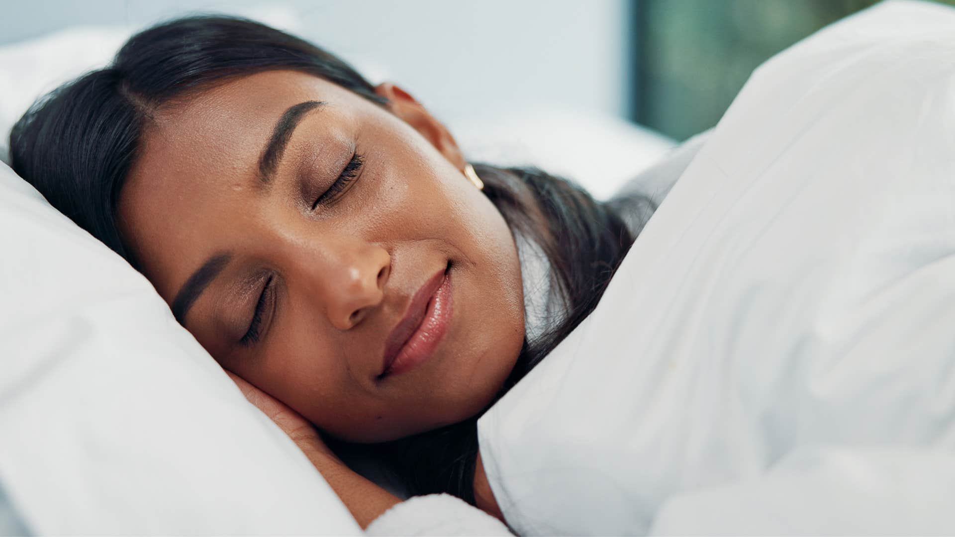 woman sleeping as she gets good rest