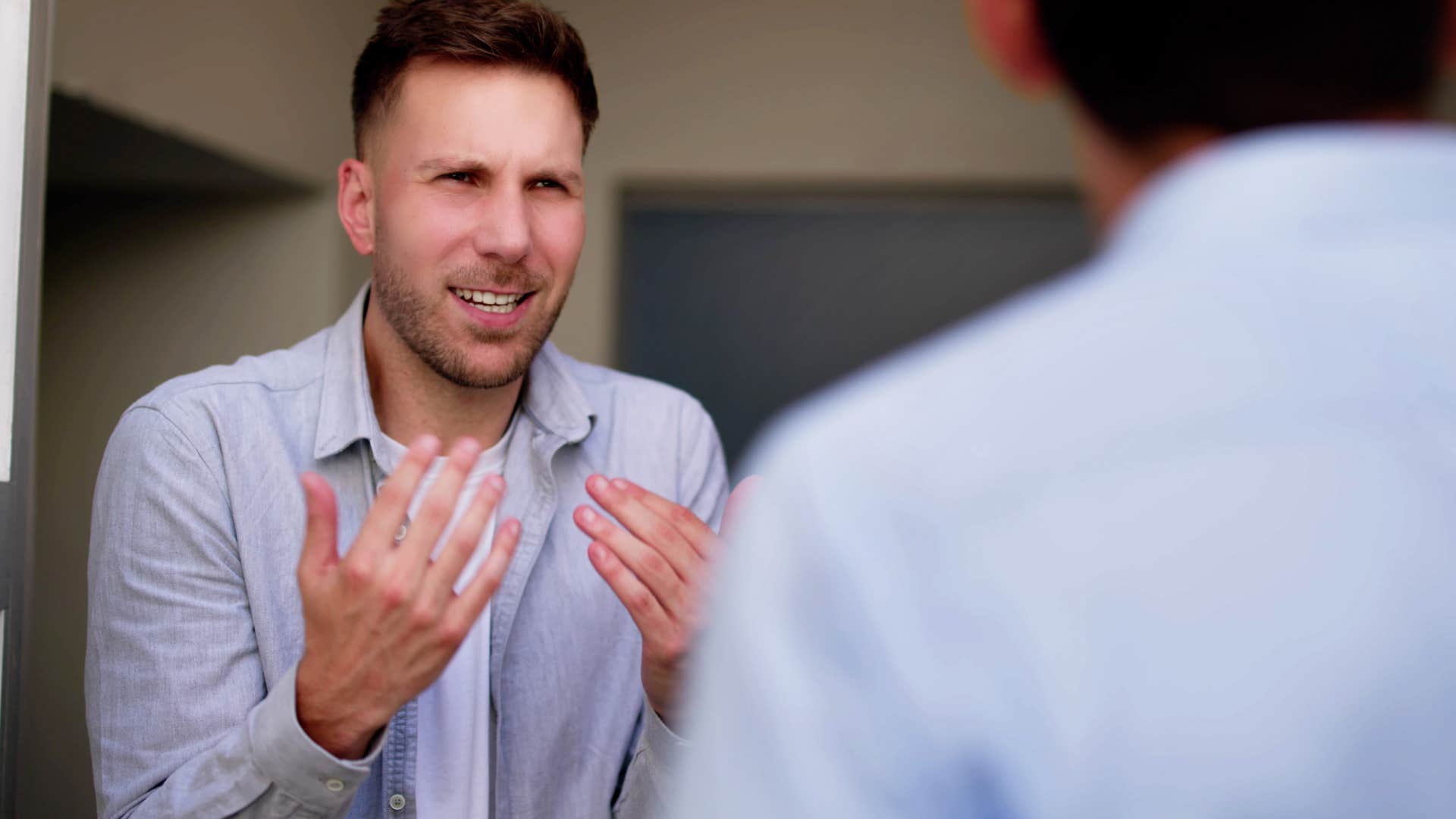 man bringing out the worst in his friend during argument