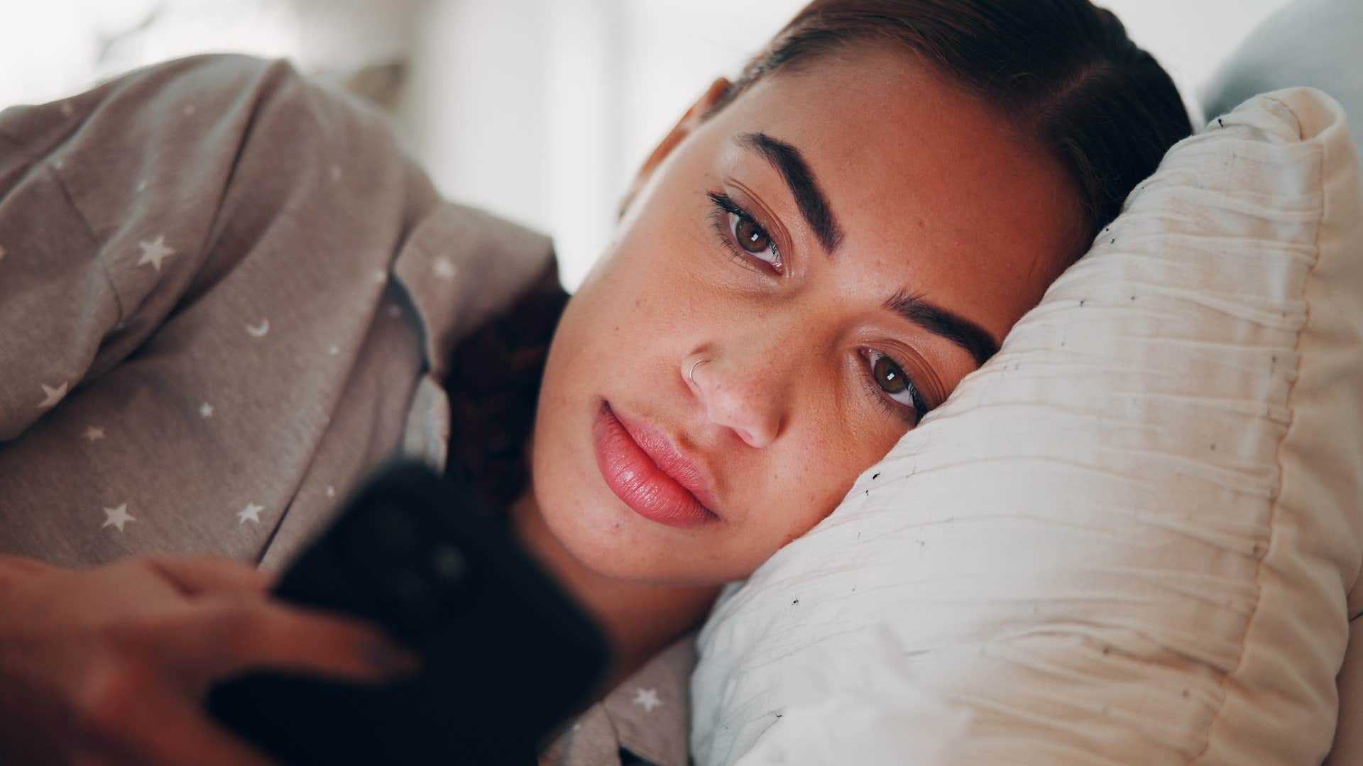 woman on her phone putting in more effort with friends than they do