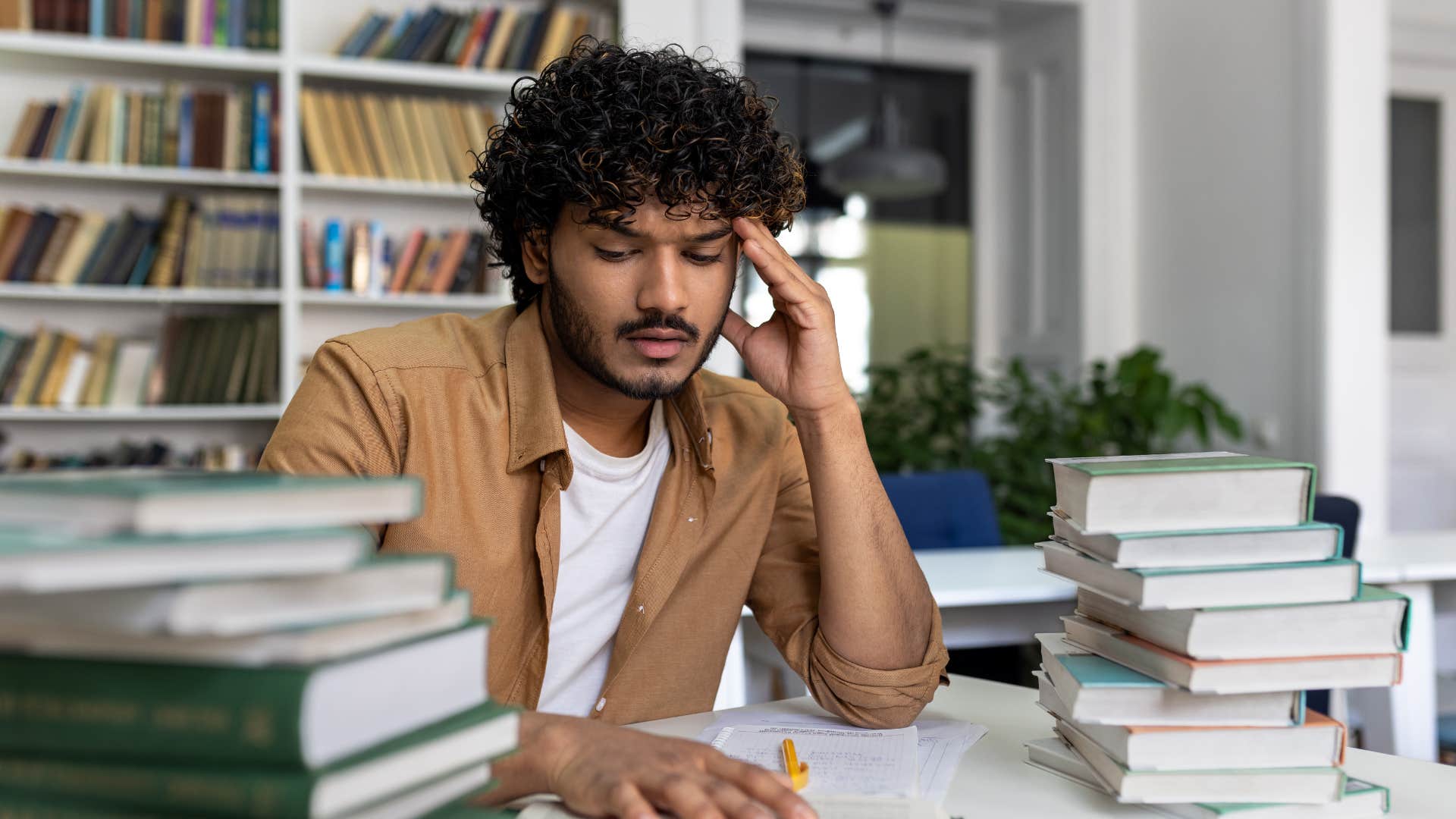 man doing research at his desk