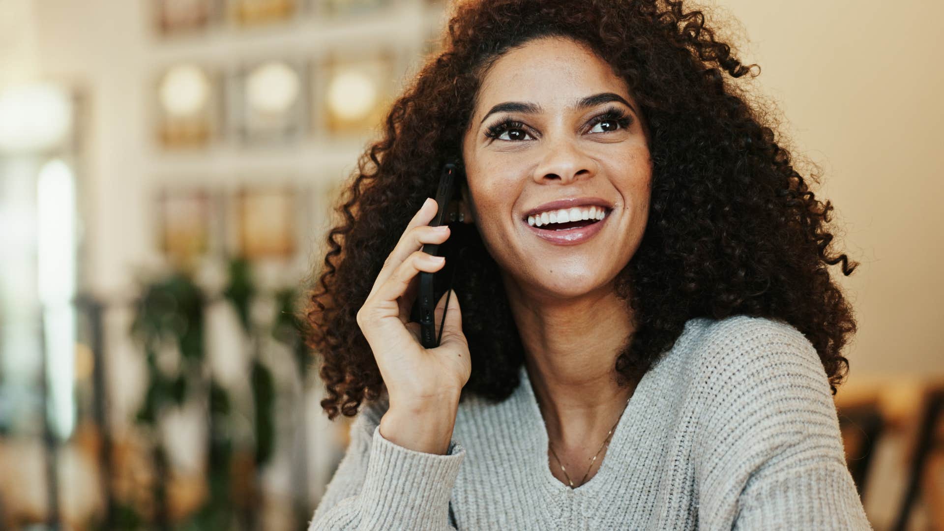 woman on the phone with her partner saying i remembered that