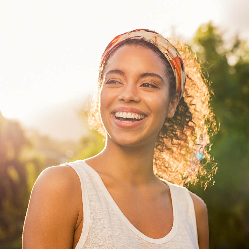 optimistic woman out in the sunshine