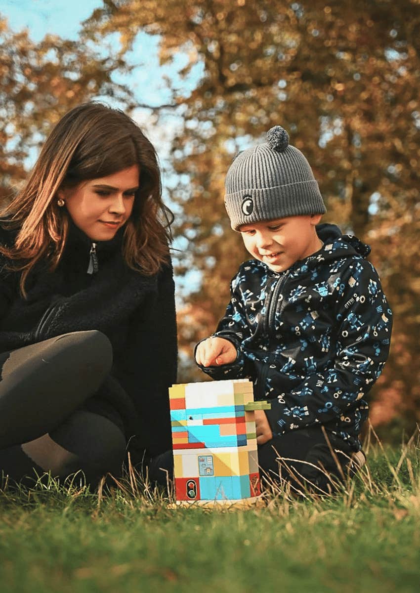 parent watching child play supportively