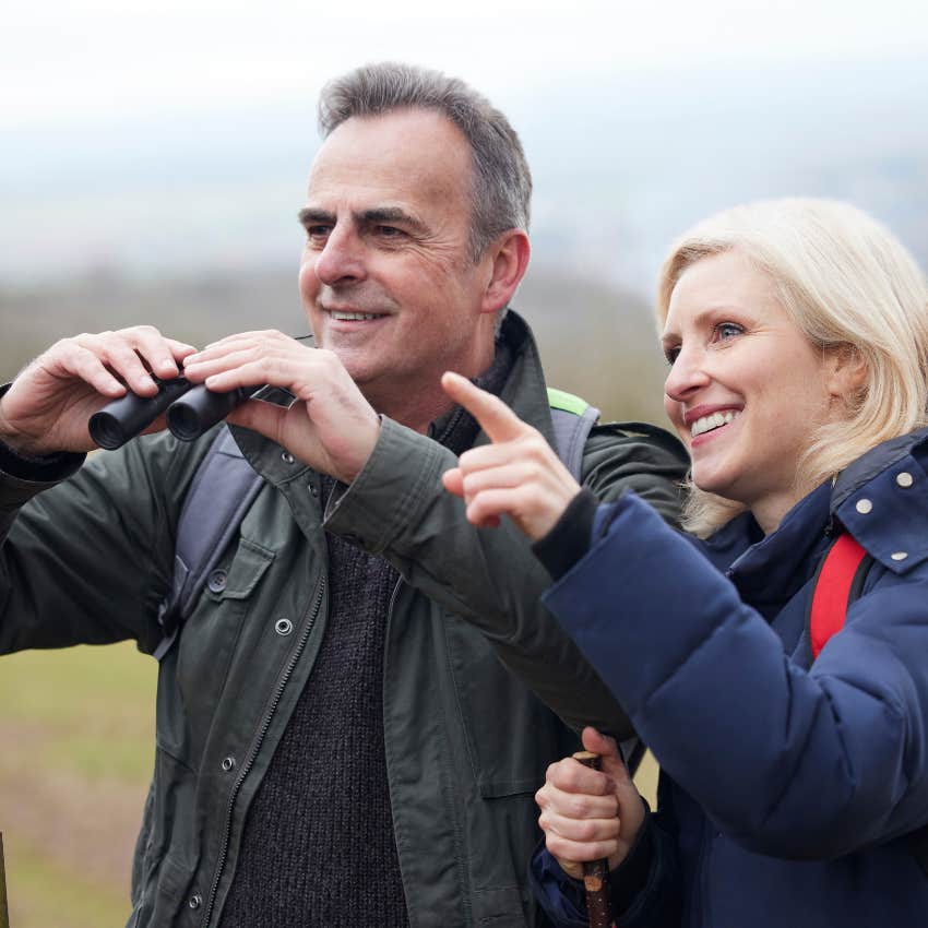 couple who is protecting their brain by engaging in birdwatching hobby
