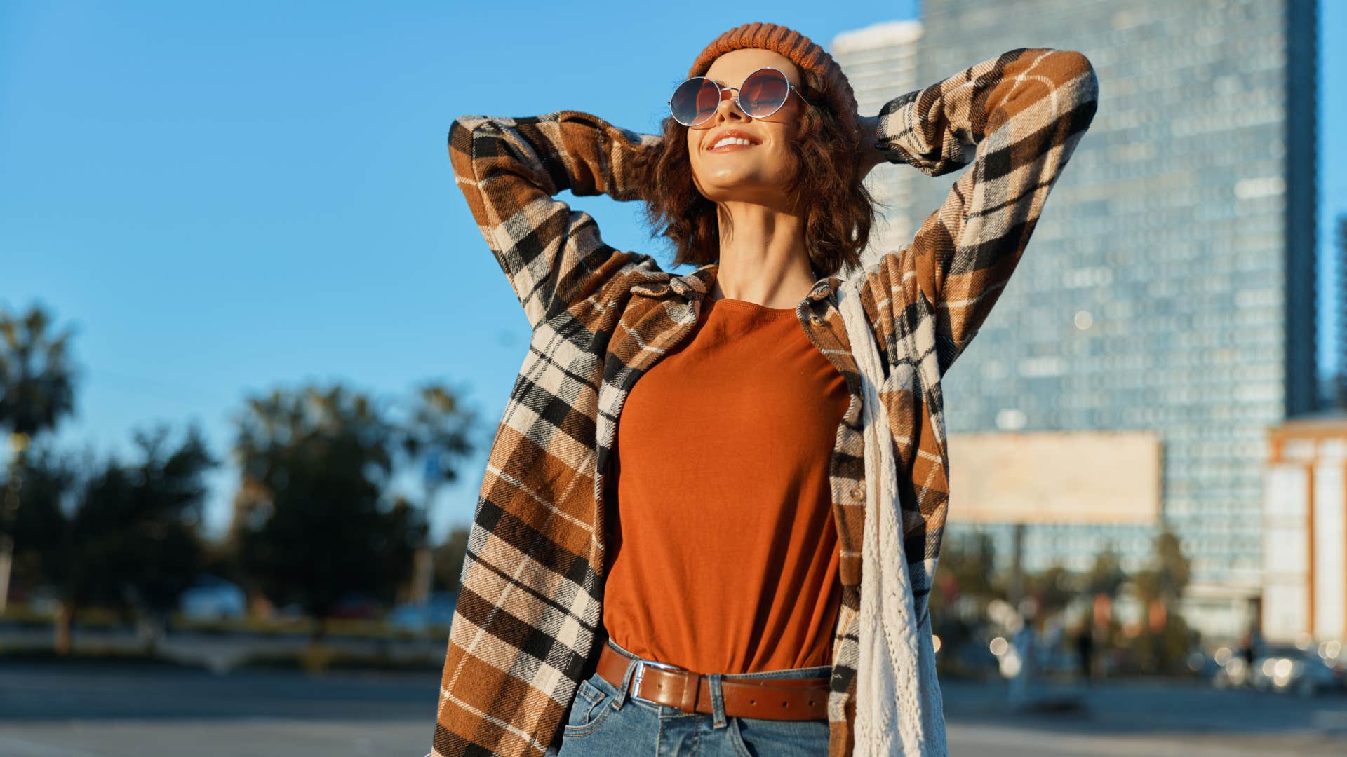 woman smiling brightly as she has a strong sense of identity 
