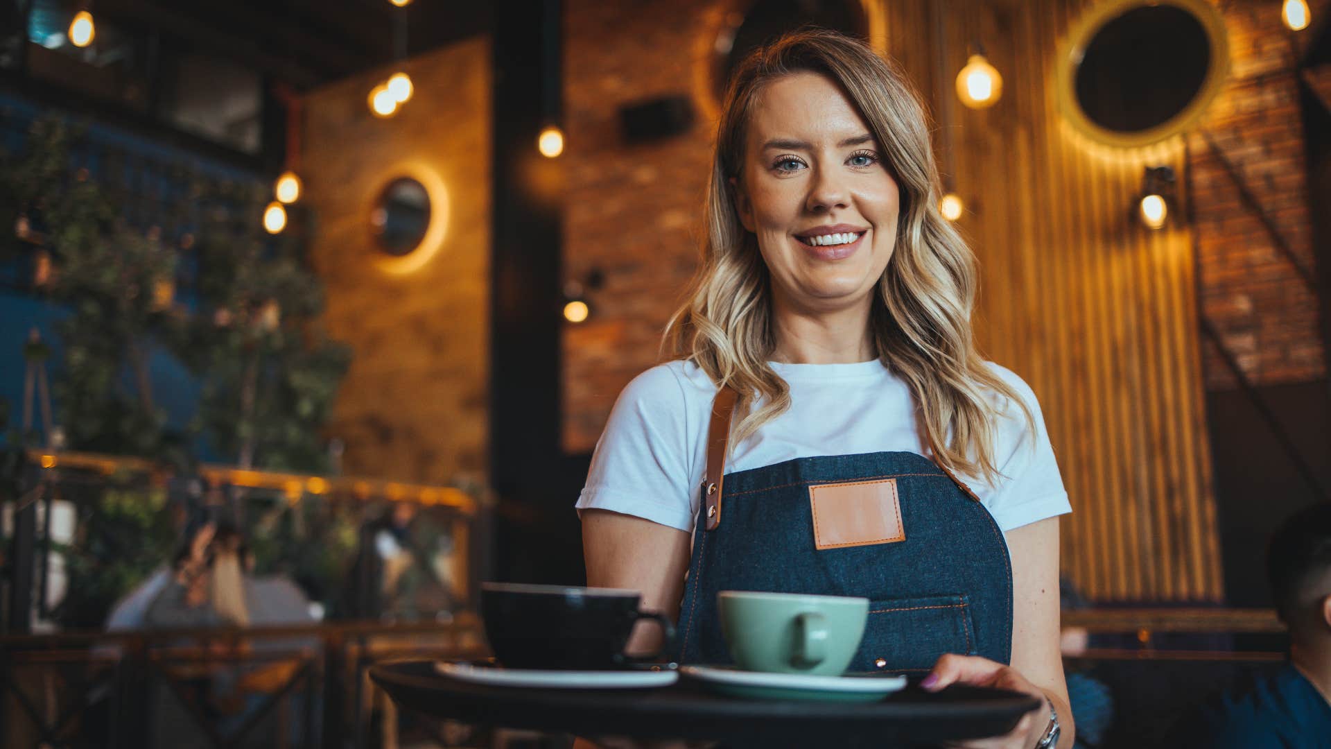 kind waitress smiling giving good customer service
